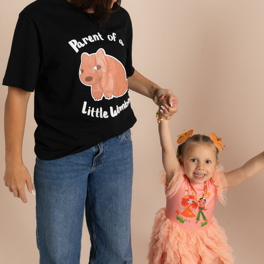 Adult wearing Parent of a Little Wombat t-shirt at an Emma Memma show