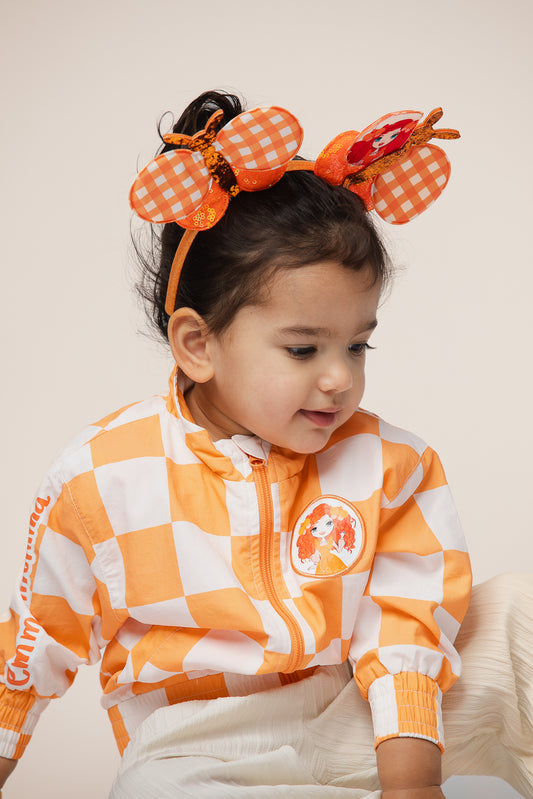 Child wearing Emma Memma bomber jacket outdoors