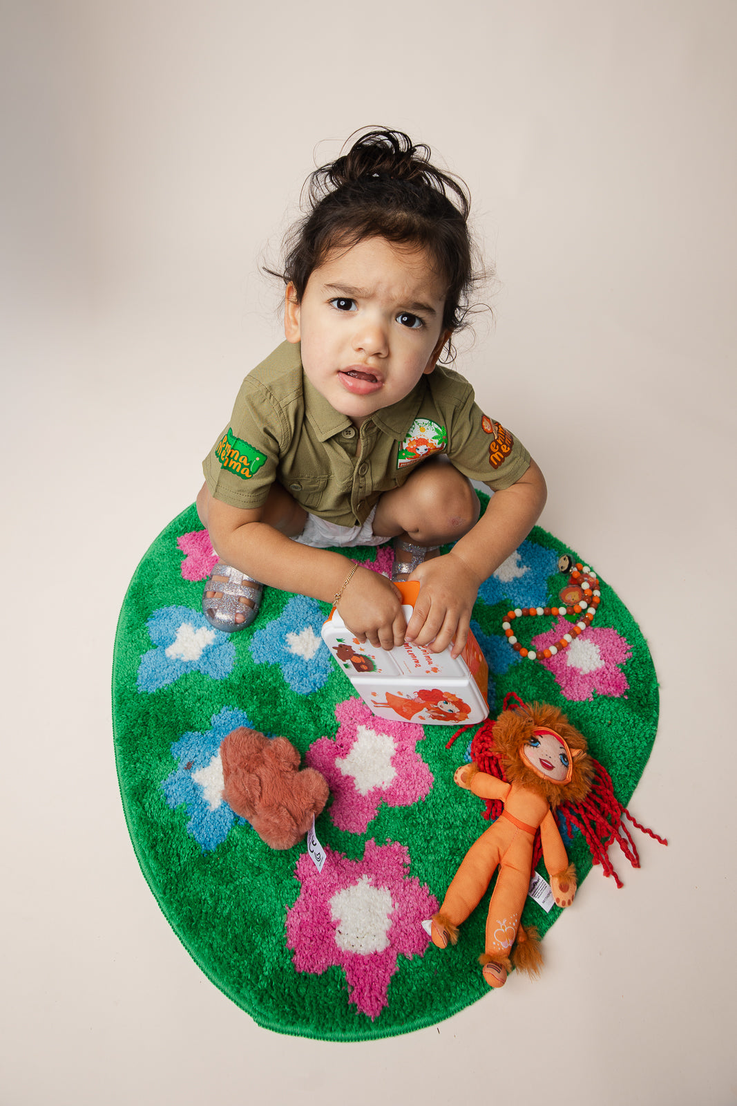 Emma Memma Lion plush bag tag attached to a kids school bag