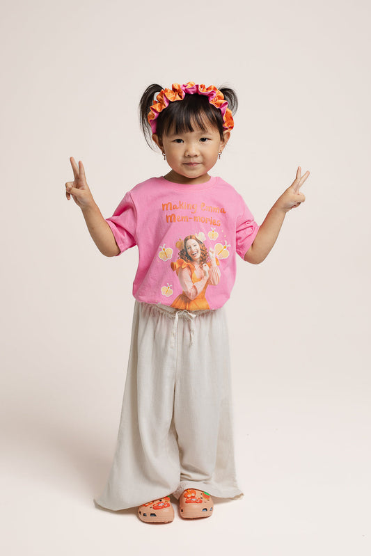 Child wearing Emma Memma pink Mem-mories t-shirt outdoors
