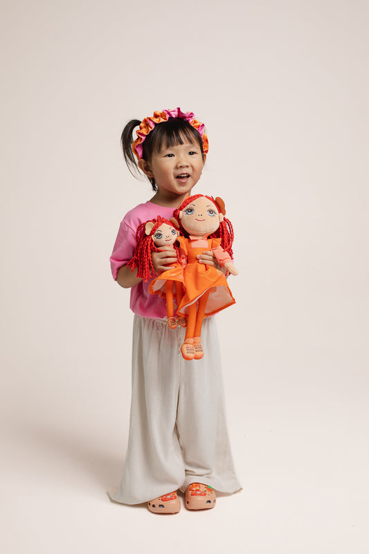Emma Memma Ragdoll small being held by a child