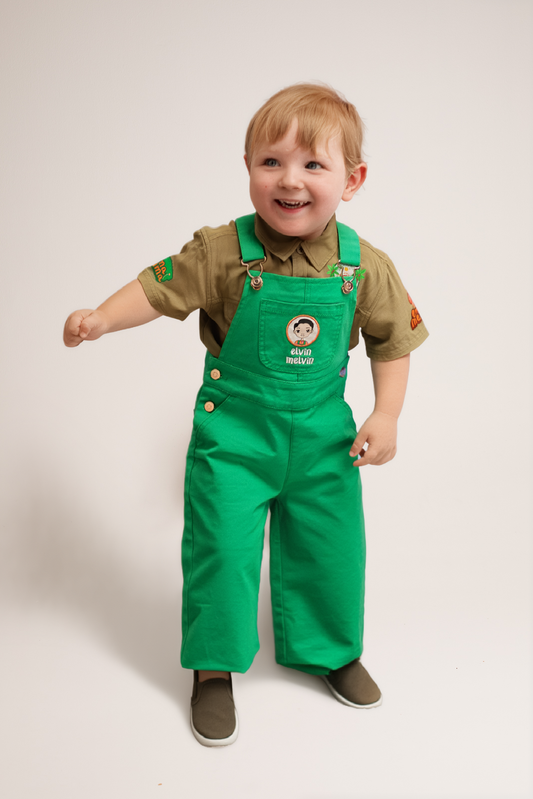Child wearing Elvin Melvin overalls outdoors
