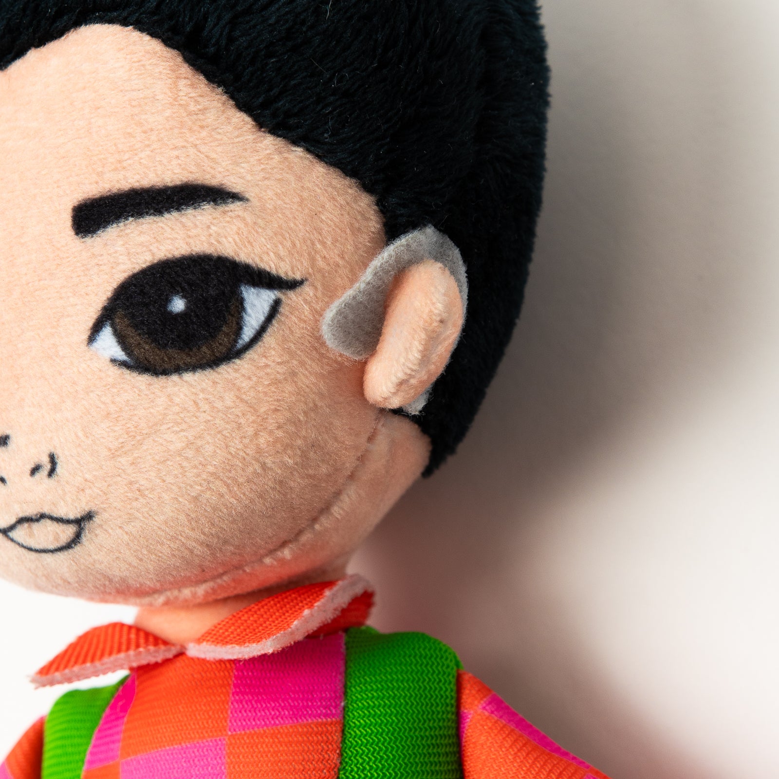 Elvin Melvin plush toy held by a child at an Emma Memma show
