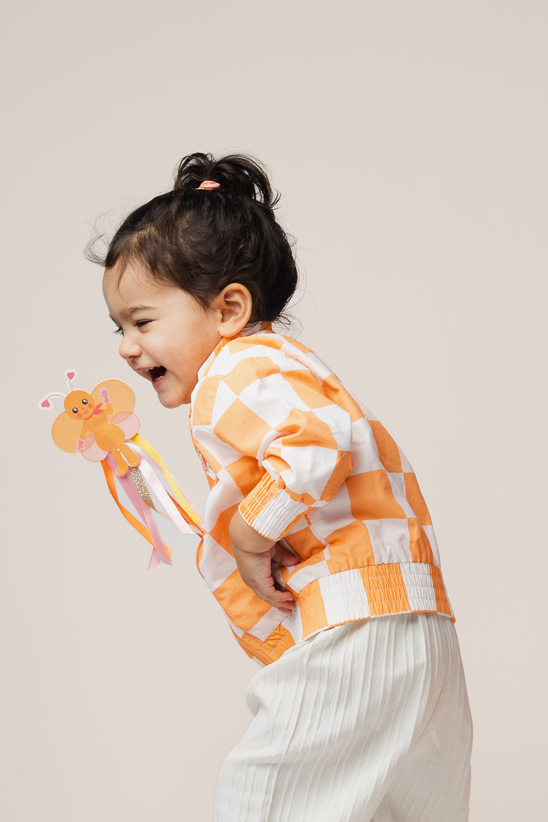 Child waving Emma Memma BB Butterfly Wand dancing