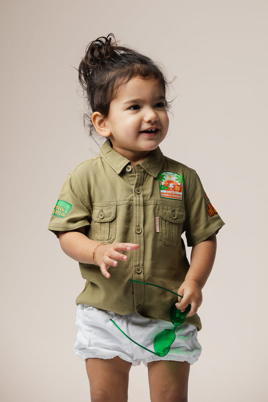 Child wearing Emma Memma Jungle Picnic shirt outdoors