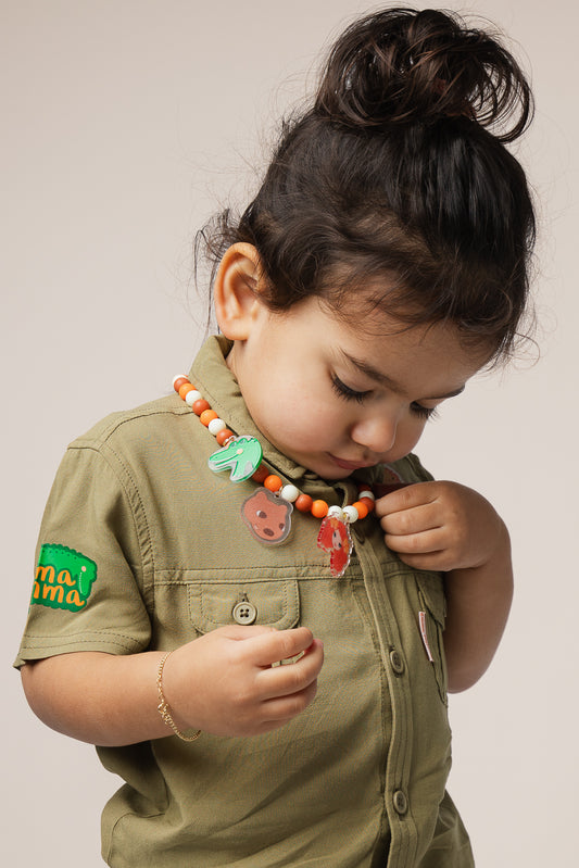 Child wearing Emma Memma Jungle Picnic Necklace