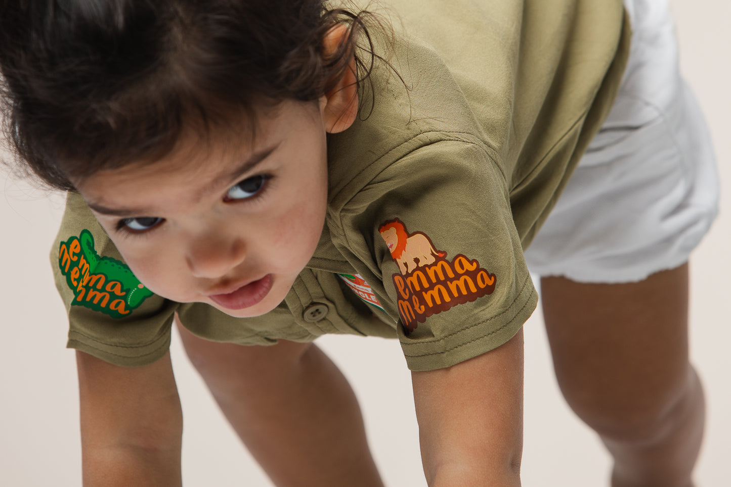 Child wearing Emma Memma Jungle Picnic shirt smiling