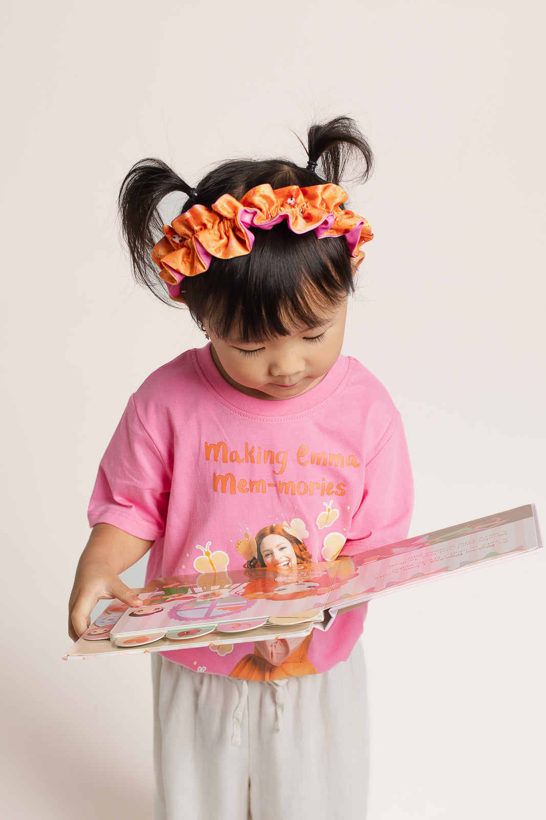 Child wearing Emma Memma Reversible Frill Headband Emma Memma print side