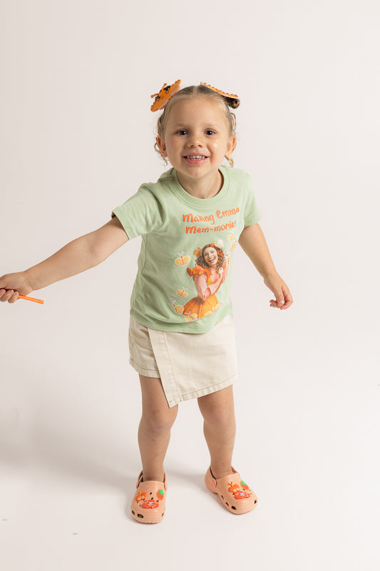 Child wearing Emma Memma sage green Mem-mories t-shirt