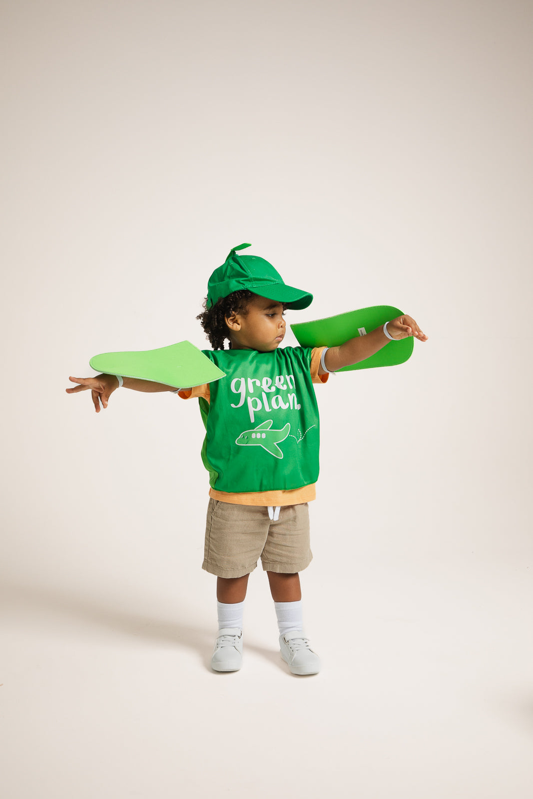 Child wearing Emma Memma Green Plane costume front view