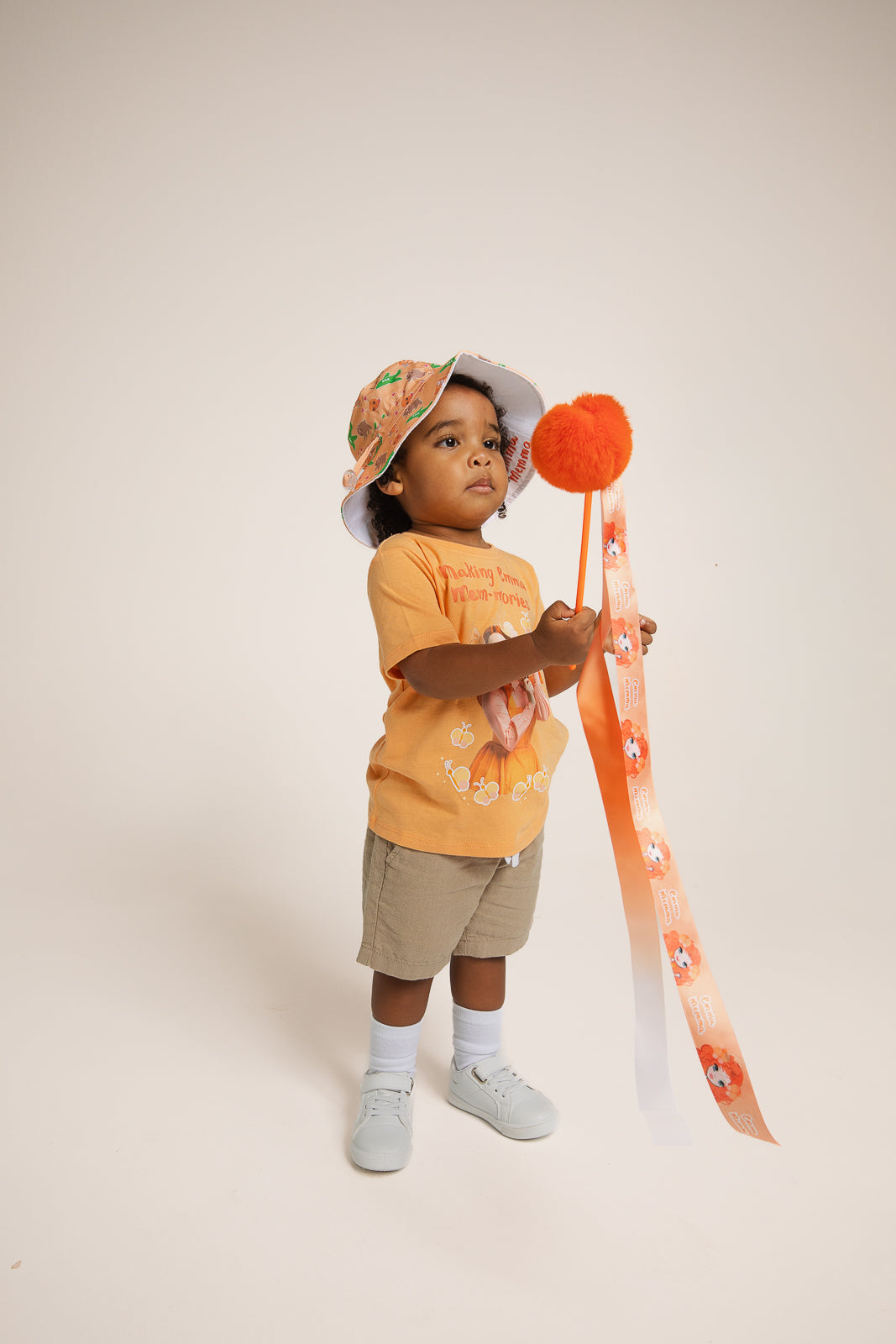 Child waving Emma Memma Pom Pom Twirly Ribbon dancing
