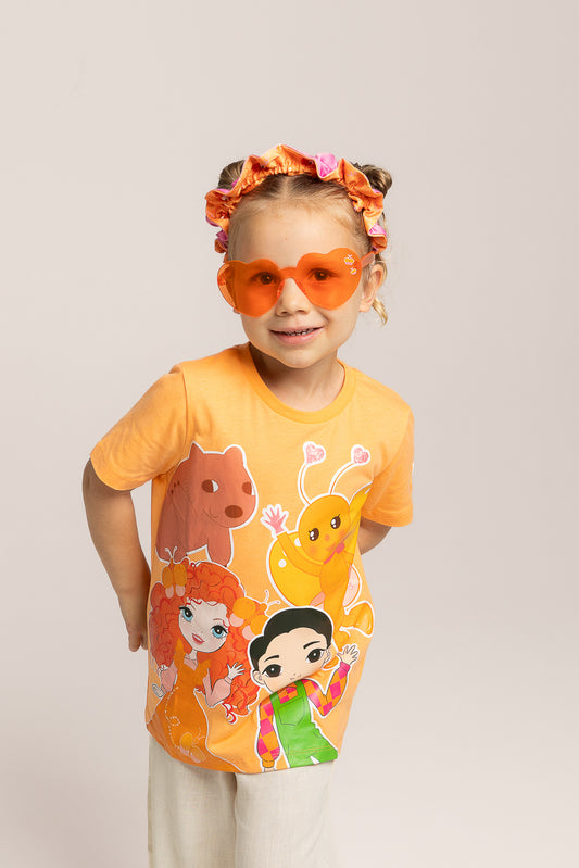 Child wearing Emma Memma orange heart shaped sunglasses