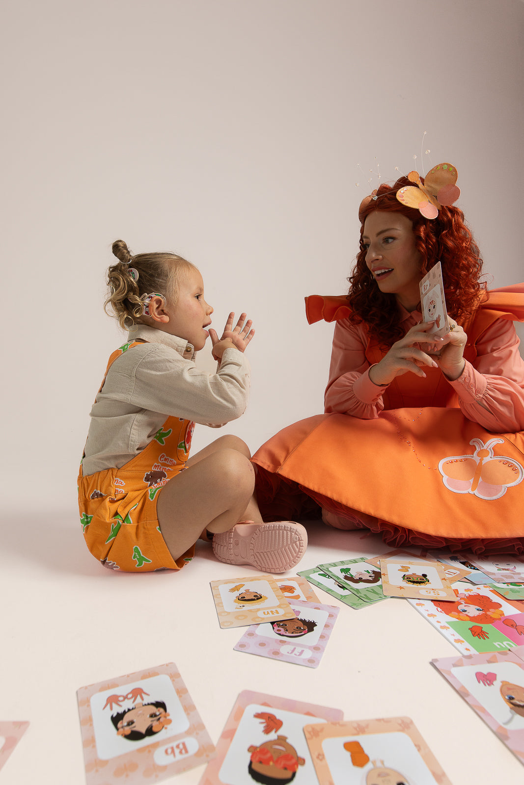 Emma Memma Auslan Flashcards spread out showing alphabet signs