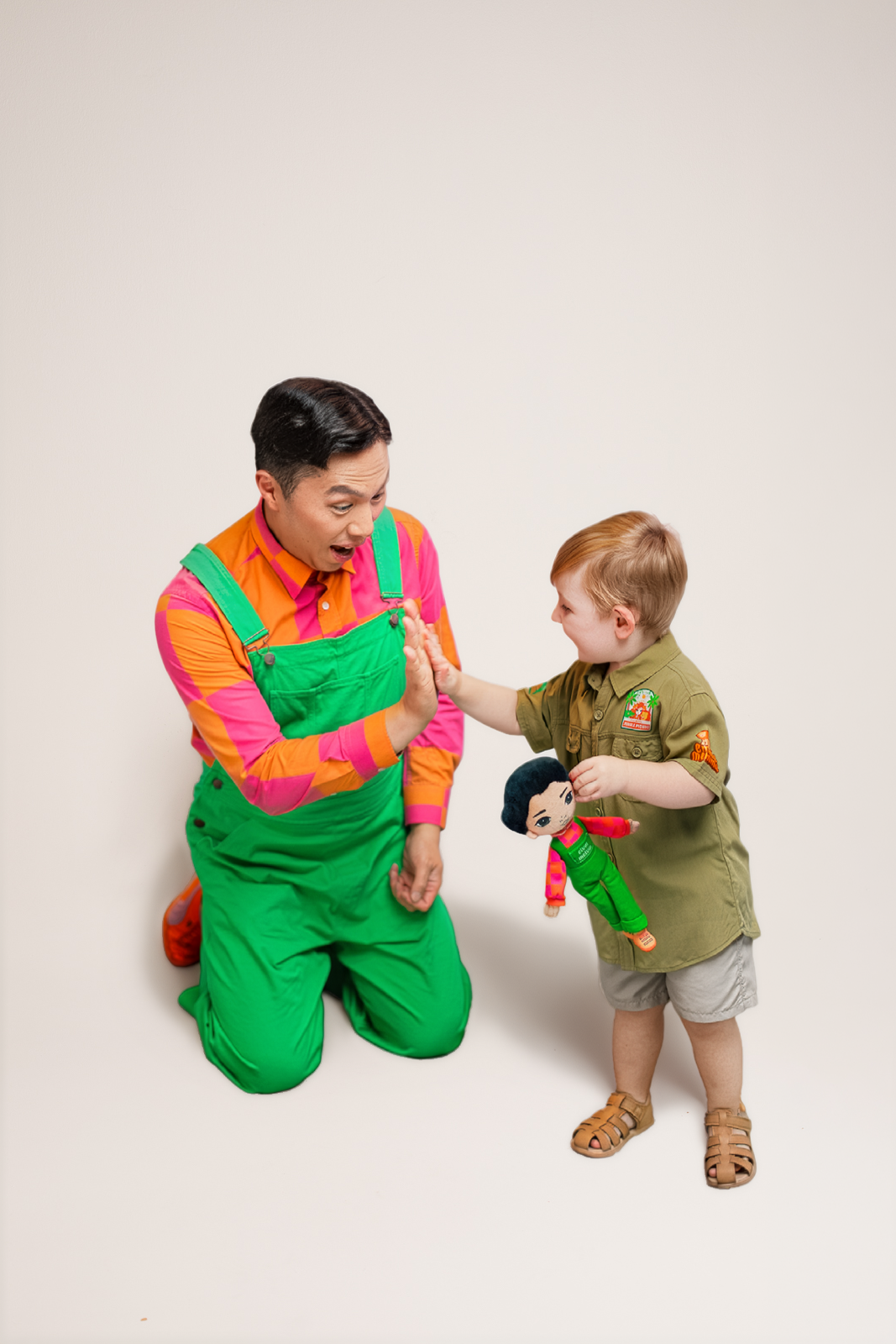 Elvin Melvin plush toy being held by a child showing scale
